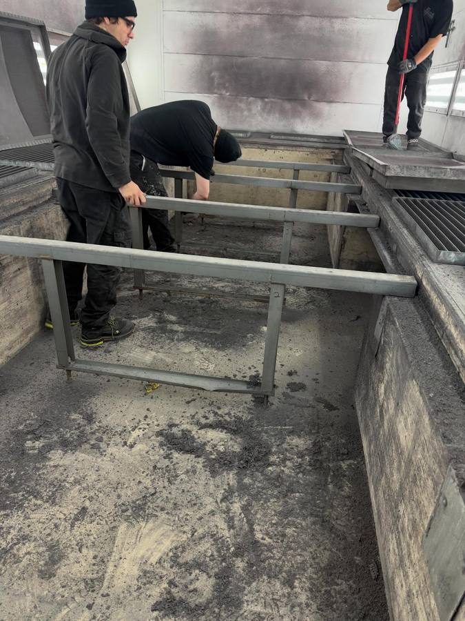 Crew cleaning out a downdraft pit